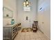 Inviting foyer featuring tile floors, a decorative console table, and a rocking chair at 1758 E San Xavier Dr, Casa Grande, AZ 85122