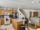 Eat-in kitchen featuring wood cabinets, an island with seating, and stainless steel appliances at 1758 E San Xavier Dr, Casa Grande, AZ 85122