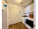 Laundry room with built-in cabinets, laundry sink, and a tile floor at 1758 E San Xavier Dr, Casa Grande, AZ 85122