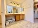 Bathroom featuring a double vanity and a large mirror at 1758 E San Xavier Dr, Casa Grande, AZ 85122