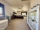 Spacious main bedroom featuring a fan, sitting area, cabinet, and lots of light at 1758 E San Xavier Dr, Casa Grande, AZ 85122