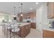 Well-appointed kitchen with an island, modern appliances, and ample cabinet space for storage and meal preparation at 18161 W Cielo Grande Ave, Surprise, AZ 85387