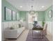 Inviting home office with modern desk, comfortable seating, and elegant decor with a large window at 18161 W Cielo Grande Ave, Surprise, AZ 85387