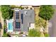 Aerial view showcasing a modern home with solar panels, a pristine pool, and well-maintained landscaping at 1839 E Palo Verde Dr, Phoenix, AZ 85016