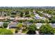 Charming neighborhood aerial view showcasing tree-lined streets and diverse home styles with beautiful mountain backdrop at 1839 E Palo Verde Dr, Phoenix, AZ 85016