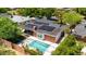 Aerial showcasing a well-maintained pool area and solar panels; inviting outdoor space for relaxation and eco-friendly living at 1839 E Palo Verde Dr, Phoenix, AZ 85016