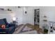 Bedroom with ample storage including closet and shelves with a plush armchair at 1839 E Palo Verde Dr, Phoenix, AZ 85016