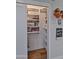 Bright, organized closet featuring shelving, storage bins, and ample space at 1839 E Palo Verde Dr, Phoenix, AZ 85016