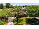 Charming home with mature trees, lush lawn, and brick accents, nestled in a serene neighborhood setting at 1839 E Palo Verde Dr, Phoenix, AZ 85016