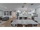 Open floor plan showcasing kitchen, dining, and living areas with hardwood flooring at 1839 E Palo Verde Dr, Phoenix, AZ 85016