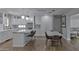 Bright, open kitchen featuring a large island, modern lighting, and stainless steel appliances at 1839 E Palo Verde Dr, Phoenix, AZ 85016
