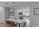 Dining area transitioning to living space with custom window seating and modern decor at 1839 E Palo Verde Dr, Phoenix, AZ 85016