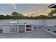 Stylish outdoor kitchen featuring a stainless steel grill, mini fridge, and comfortable cushioned bench seating at 1839 E Palo Verde Dr, Phoenix, AZ 85016