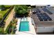 Inviting backyard pool with solar panels, lush greenery, and lounge chairs at 1839 E Palo Verde Dr, Phoenix, AZ 85016