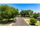 Charming tree-lined street with well-maintained homes and green lawns at 1839 E Palo Verde Dr, Phoenix, AZ 85016