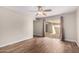 Bedroom with wood floors, a ceiling fan, and sliding doors to the backyard at 1887 E La Donna Dr, Tempe, AZ 85283