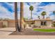 Charming single-Gathering home with a well-manicured front yard, mature palm trees, and inviting curb appeal at 1887 E La Donna Dr, Tempe, AZ 85283