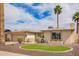 Charming home exterior with manicured landscaping, mature palm trees, and a well-maintained front yard at 1887 E La Donna Dr, Tempe, AZ 85283