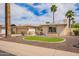 Well-maintained home with a tidy front yard, mature palm trees, and a welcoming curb appeal at 1887 E La Donna Dr, Tempe, AZ 85283