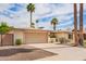 Lovely home featuring a spacious garage, mature palm trees, and a beautifully landscaped front yard at 1887 E La Donna Dr, Tempe, AZ 85283