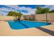 Refreshing swimming pool surrounded by lush greenery, offering a private retreat for relaxation and enjoyment at 1887 E La Donna Dr, Tempe, AZ 85283