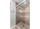 Modern tiled shower with glass door and chrome fixtures at 1887 E La Donna Dr, Tempe, AZ 85283