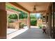 Covered back porch featuring a ceiling fan and nice pergola at 19319 E Thornton Rd, Queen Creek, AZ 85142