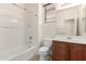 Bright bathroom with white tub, vanity and natural light at 19319 E Thornton Rd, Queen Creek, AZ 85142