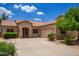 Charming single-story home with desert landscaping, spacious driveway, and a two-car garage at 19319 E Thornton Rd, Queen Creek, AZ 85142