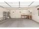 Spacious garage with workbench and storage, offering ample room at 19319 E Thornton Rd, Queen Creek, AZ 85142