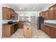 Well-equipped kitchen featuring stainless steel appliances, granite countertops, and a center island at 19319 E Thornton Rd, Queen Creek, AZ 85142