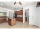 Spacious kitchen boasting a center island, granite countertops, and ample cabinet space at 19319 E Thornton Rd, Queen Creek, AZ 85142