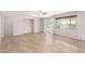 Open-concept living room with tile floors, recessed lighting, and sliding glass doors to the patio at 19319 E Thornton Rd, Queen Creek, AZ 85142