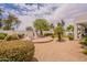 Expansive backyard with brick patio, play area, and mature landscaping at 19347 E Thornton Rd, Queen Creek, AZ 85142