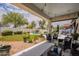 Inviting covered patio overlooking the pool and well-manicured backyard at 19347 E Thornton Rd, Queen Creek, AZ 85142