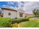 Landscaped front yard with a grassy lawn and desert plants surrounding a beautiful stucco home at 19347 E Thornton Rd, Queen Creek, AZ 85142