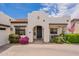 View of the front entrance featuring an arched doorway, desert landscaping, and a tile roof at 19347 E Thornton Rd, Queen Creek, AZ 85142