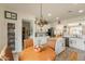 A bright kitchen with a breakfast nook, island, stainless appliances, and tiled floor at 19347 E Thornton Rd, Queen Creek, AZ 85142
