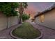 Charming backyard features a well-manicured lawn, desert landscaping, and plenty of privacy at 19651 N 34Th St, Phoenix, AZ 85050