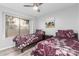 Charming bedroom with two twin beds, wood blinds, and ceiling fan at 19651 N 34Th St, Phoenix, AZ 85050