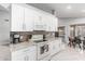 Modern kitchen with white cabinets, granite countertops, and stainless steel appliances at 19651 N 34Th St, Phoenix, AZ 85050