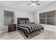 Comfortable main bedroom with neutral walls, wood blinds, and ceiling fan at 19651 N 34Th St, Phoenix, AZ 85050