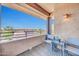 Charming balcony with cozy seating offers stunning views of the neighborhood and blue sky at 20100 N 78Th Pl # 3103, Scottsdale, AZ 85255