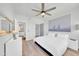 Spacious bedroom with ceiling fan, neutral decor, and ample natural light at 20100 N 78Th Pl # 3103, Scottsdale, AZ 85255