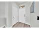 Welcoming entryway with hardwood floors, convenient coat closet, and neutral decor at 20100 N 78Th Pl # 3103, Scottsdale, AZ 85255