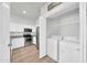 Bright kitchen featuring stainless steel appliances and an adjacent laundry area at 20100 N 78Th Pl # 3103, Scottsdale, AZ 85255