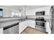 Bright kitchen featuring stainless steel appliances, white cabinets, and granite countertops at 20100 N 78Th Pl # 3103, Scottsdale, AZ 85255