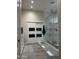 Well-appointed bathroom featuring modern sliding door, shower and custom vanity at 2013 E Valencia Dr, Phoenix, AZ 85042
