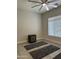 Neutral toned bedroom with ceiling fan, minimalist decor, and ample natural light at 2013 E Valencia Dr, Phoenix, AZ 85042