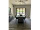 Dining area showcasing a modern table, seating for six, and view of the backyard at 2013 E Valencia Dr, Phoenix, AZ 85042